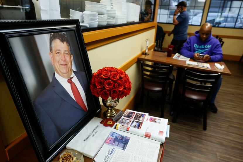 A memorial dedicated to former restaurant owner Francis Kobty remains on his reserved table...