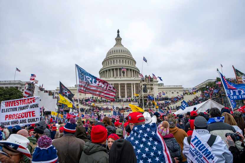 FILE - Rioters loyal to President Donald Trump at the U.S. Capitol in Washington, Jan. 6,...