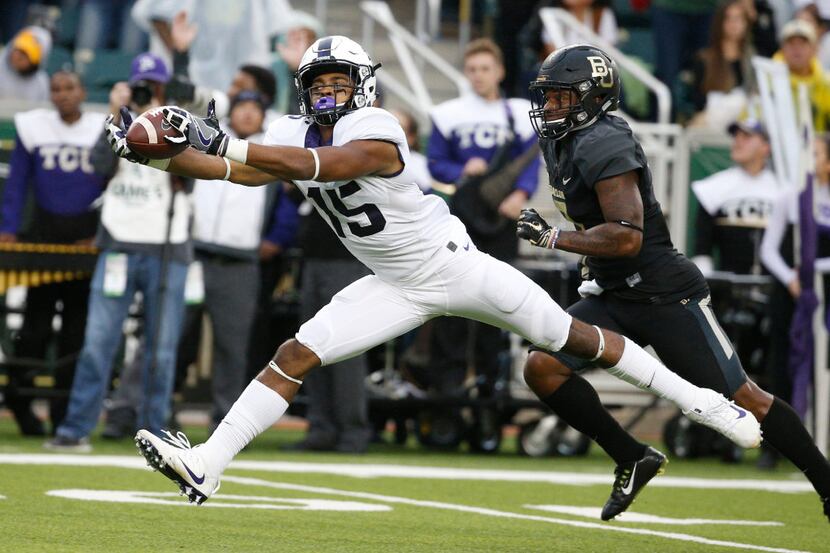 TCU Horned Frogs wide receiver Jaelan Austin (15) stretches for a catch against the Baylor...