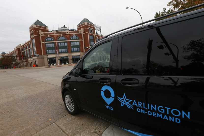 The Via Van waits for a passenger to call in at The Ballpark in Arlington in Arlington on...