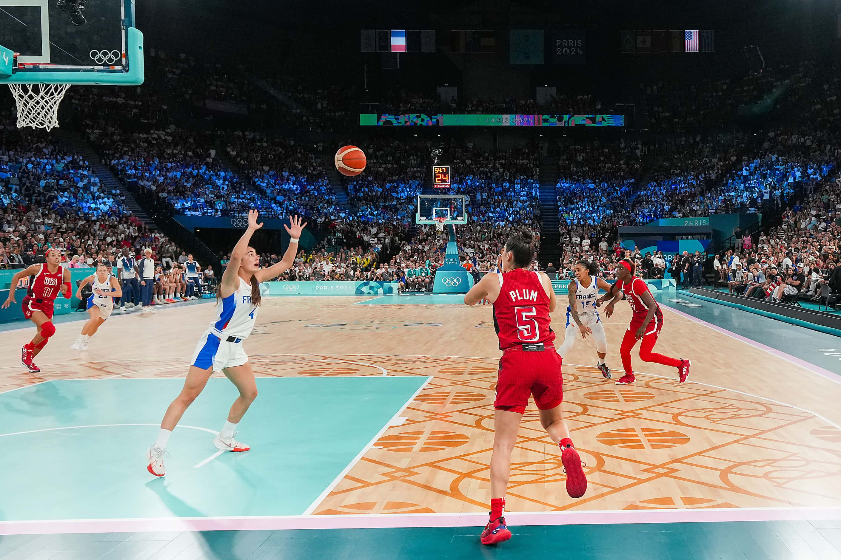 Kelsey Plum (5) of the United States inbound the ball during the final minute of the second...