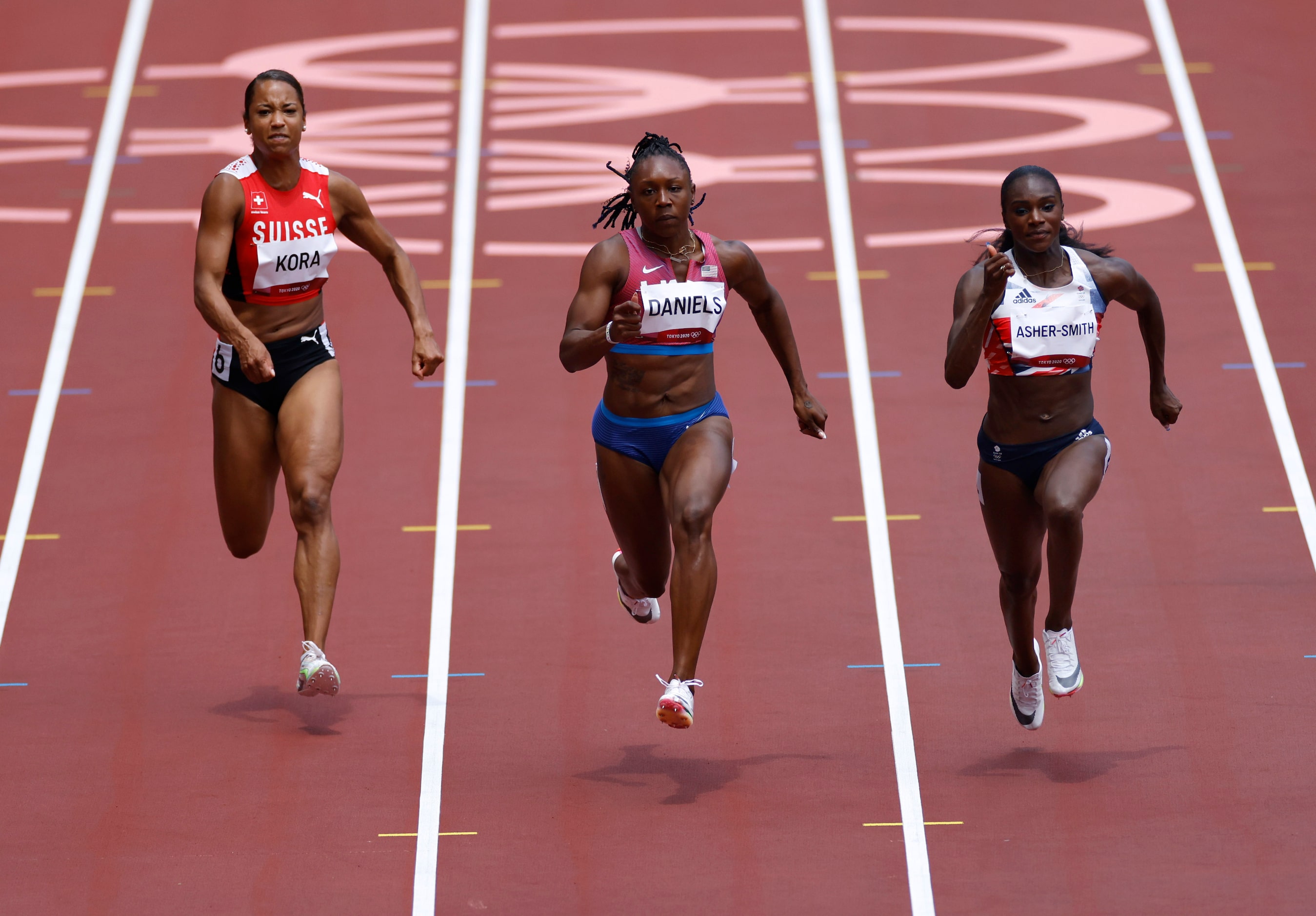 Switzerland’s Salome Kora, USA’s Teahna Daniels and Great Britain’s Dina Asher-Smith compete...