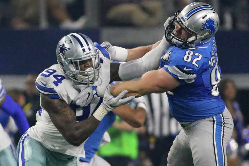 Dallas Cowboys defensive end Randy Gregory (94) rushes the passer as Detroit Lions tight end...