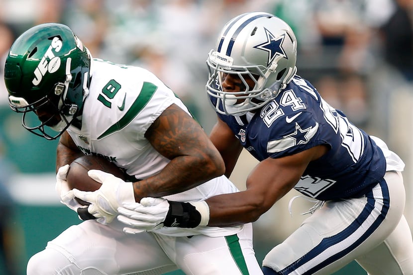 Dallas Cowboys cornerback Chidobe Awuzie (24)  wraps up New York Jets wide receiver...