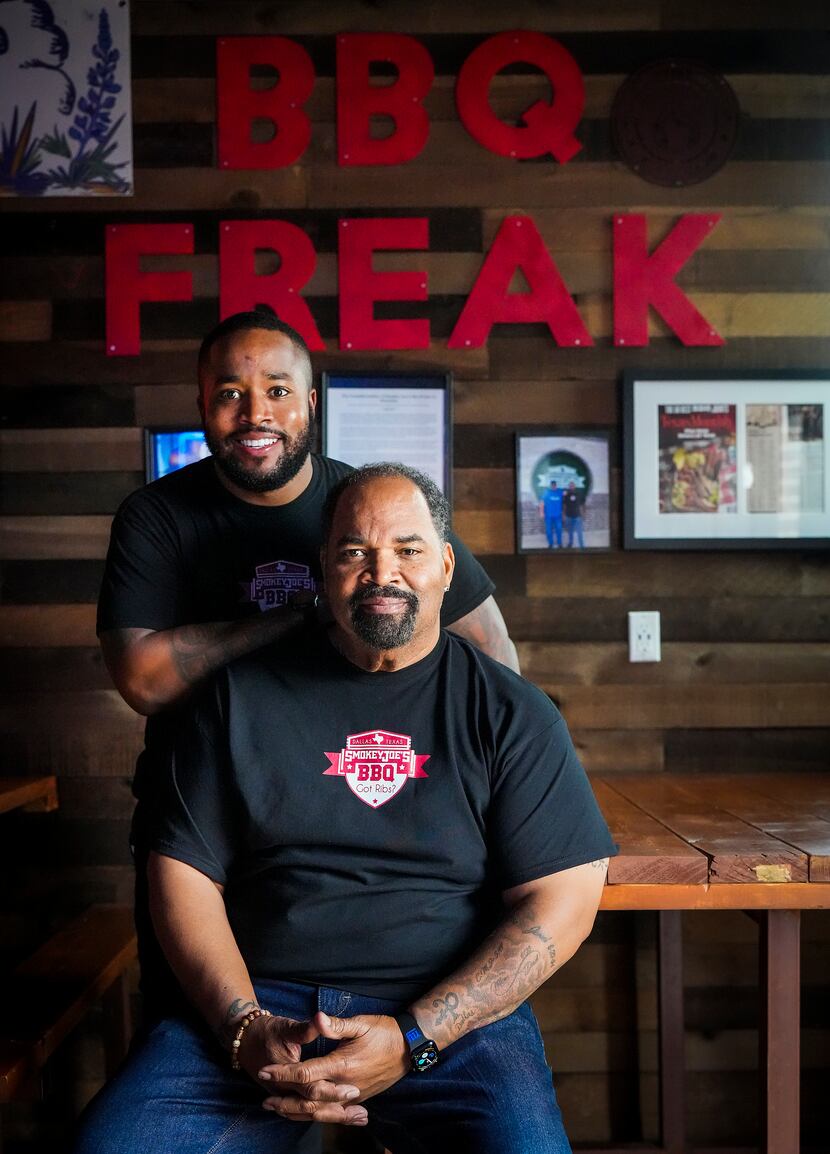 Kristopher Manning (standing) took over the Smokey Joe's BBQ business from his father,...