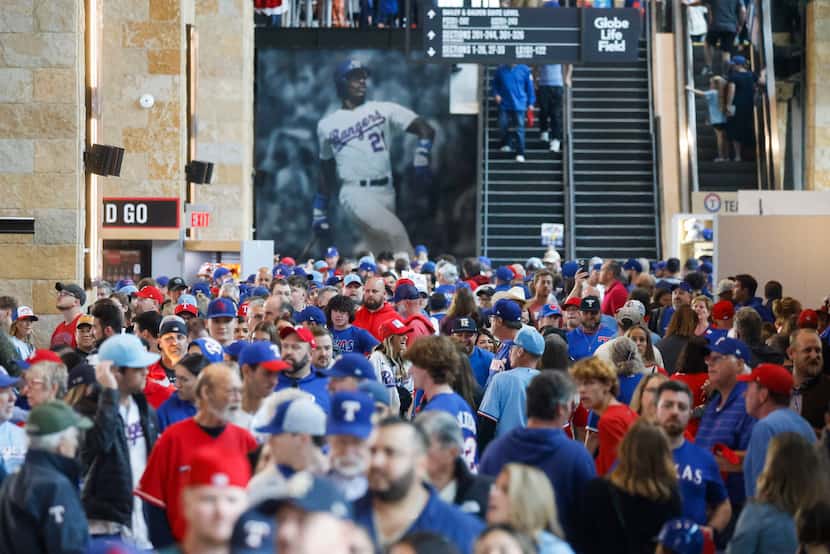 Fans make their way inside the Globe Life Field ahead of Game 2 of the baseball World Series...