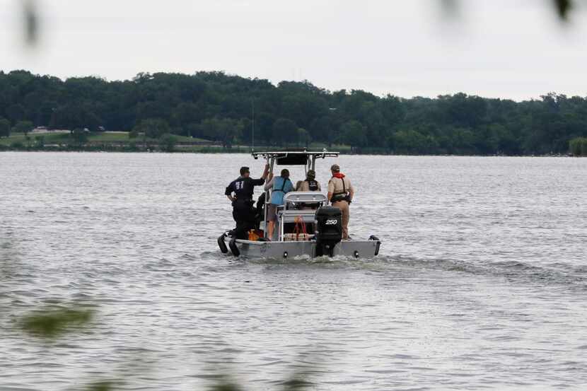 Rescuers search Monday for a man who fell off a sailboat at White Rock Lake on Sunday...