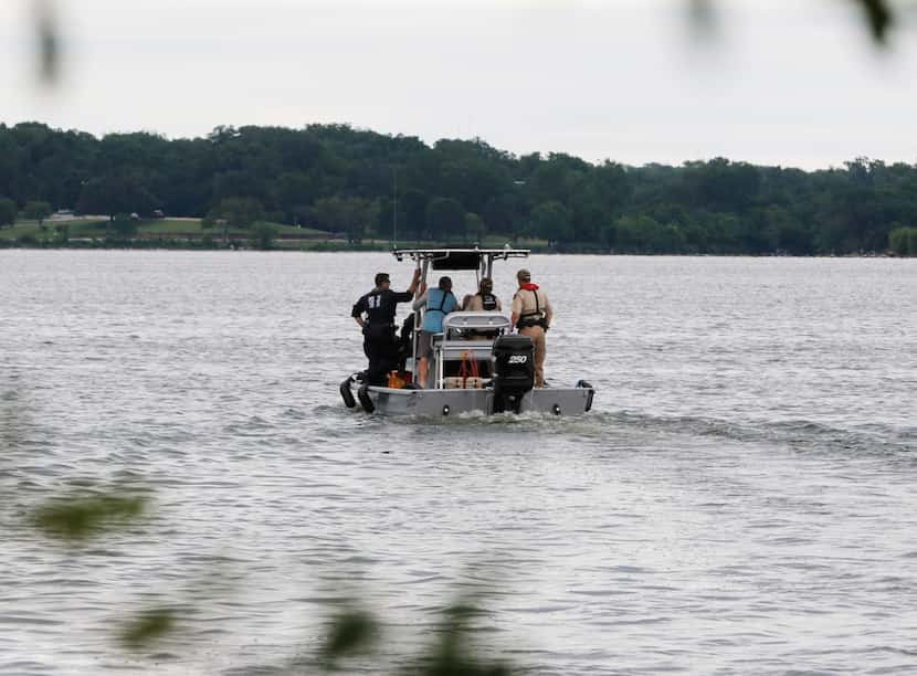 Rescuers search Monday for a man who fell off a sailboat at White Rock Lake on Sunday...