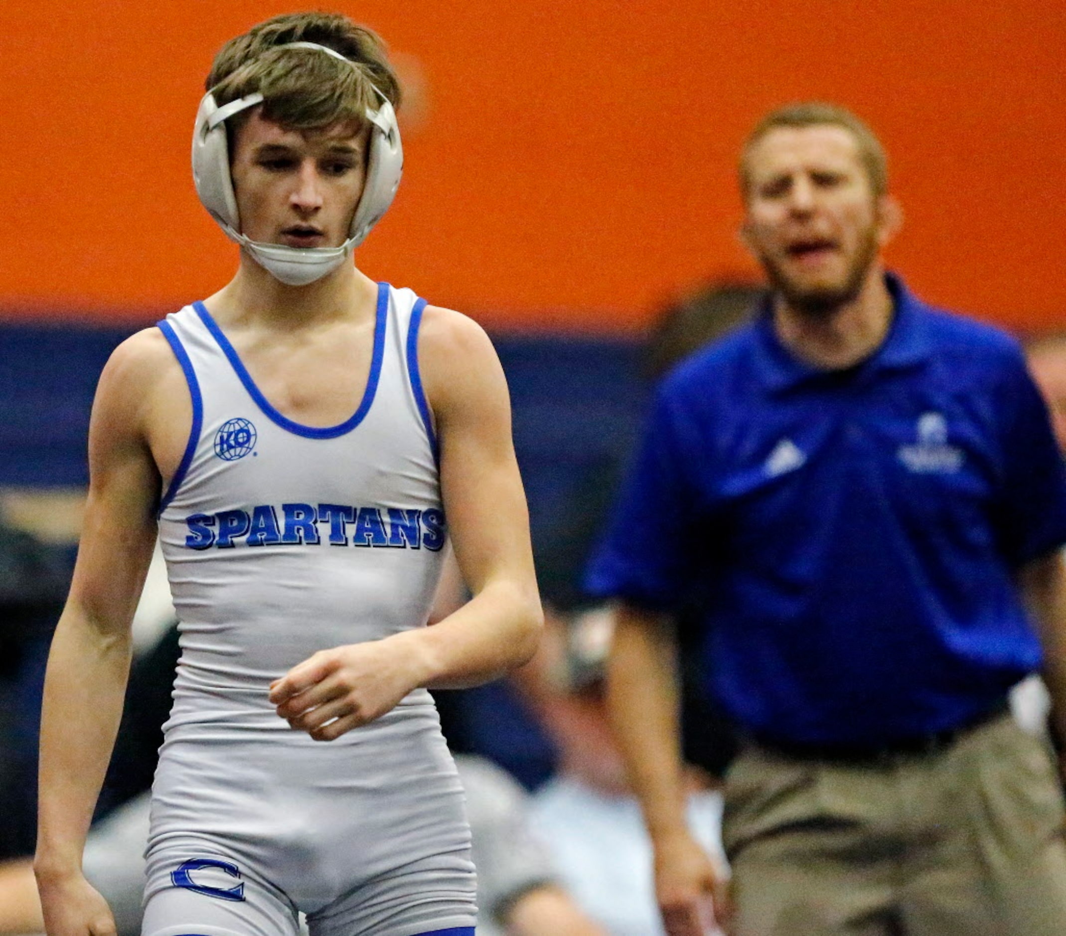 Wesley Goleman of Burleson Centennial High School, is shouted directions from his corner...