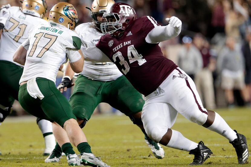UAB quarterback Tyler Johnston III (17) is caught for the sack by Texas A&M defensive...