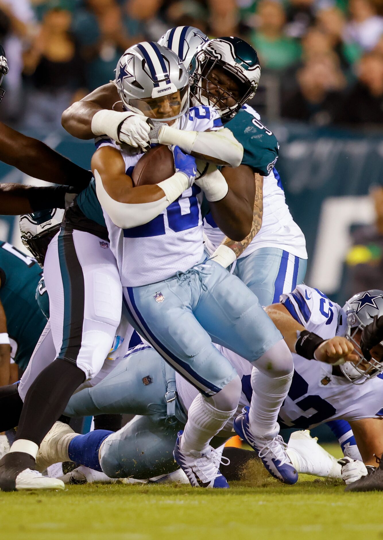 Dallas Cowboys running back Tony Pollard (20) is tackled by Philadelphia Eagles defensive...