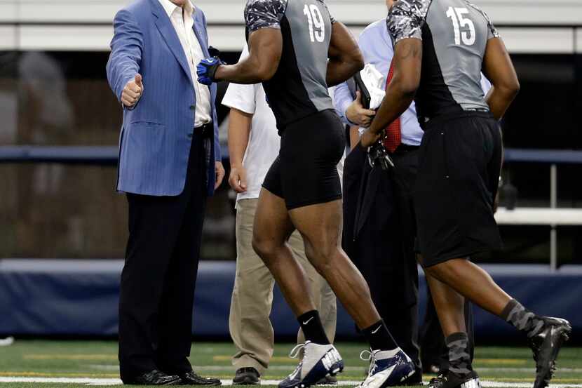 Dallas Cowboys team owner Jerry Jones, left, gives a thumbs up to Memphis safety Akeem Davis...