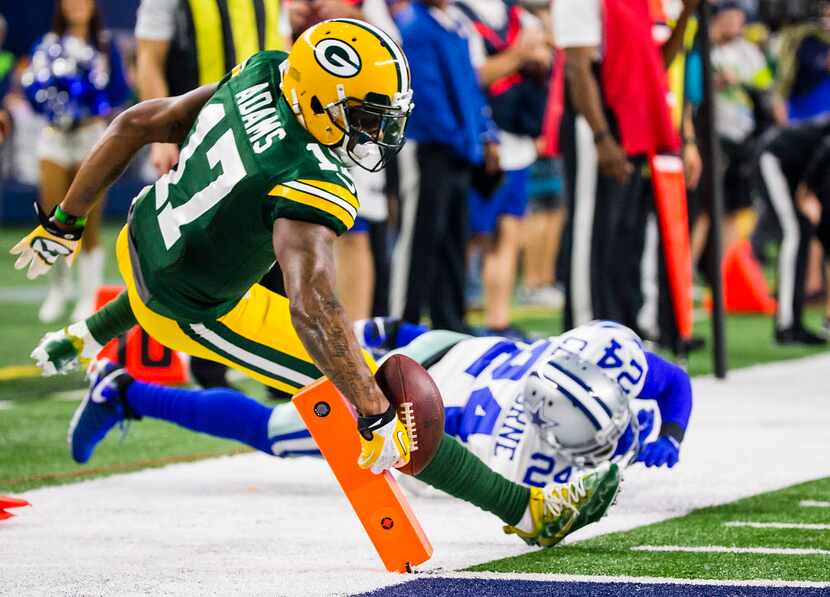 Green Bay Packers wide receiver Davante Adams (17) comes up just short of a touchdown as he...