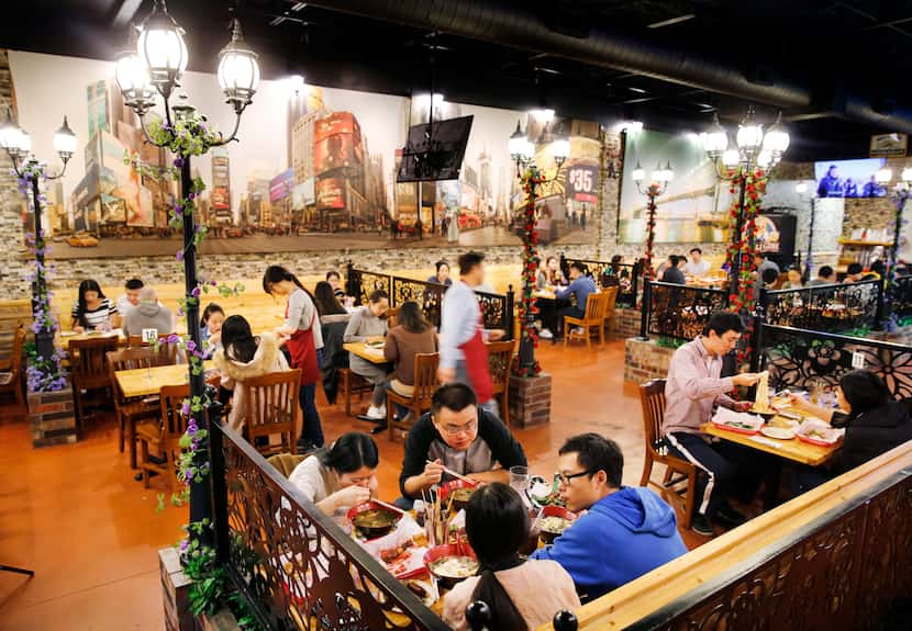 The dining room at FatNi BBQ, which specializes in the kind of Xinjiang-style grilled meat...