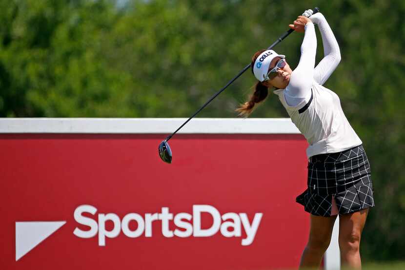 Jenny Shin, of South Korea, watches her tee shot on the 9th hole during Volunteers of...