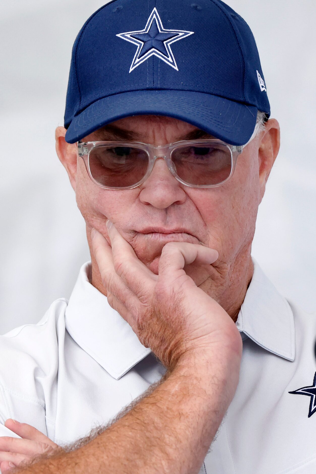 Dallas Cowboys COO/Executive Vice President Stephen Jones listens to his father and owner...