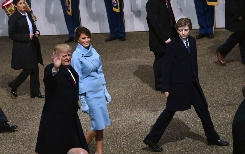 US President Donald Trump, US First Lady Melania Trump and their son Baron (R) arrive in...