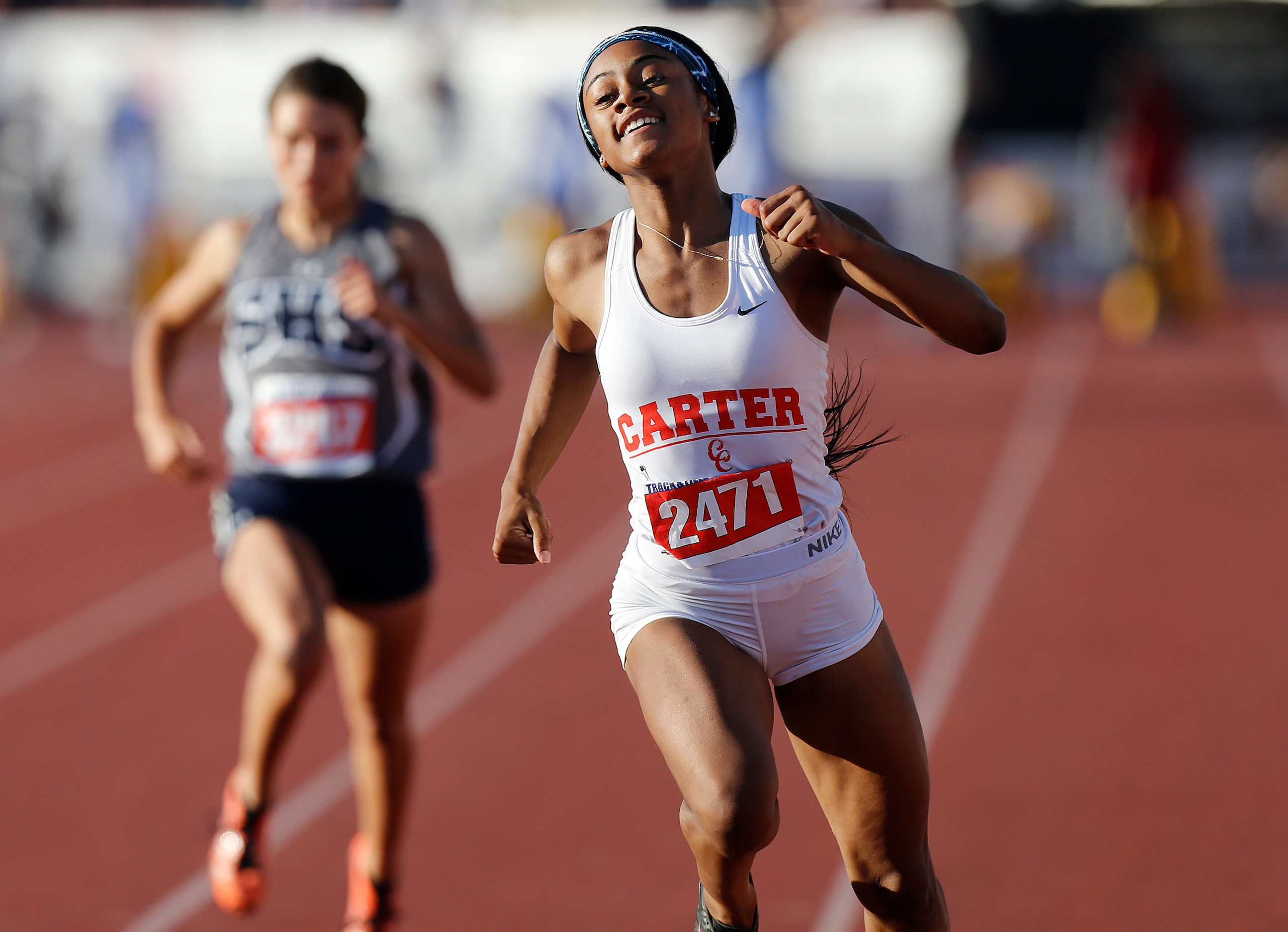 Dallas Carter's Sha'Carri Richardson (2471) finishes first in the class 4A girls 100-meter...