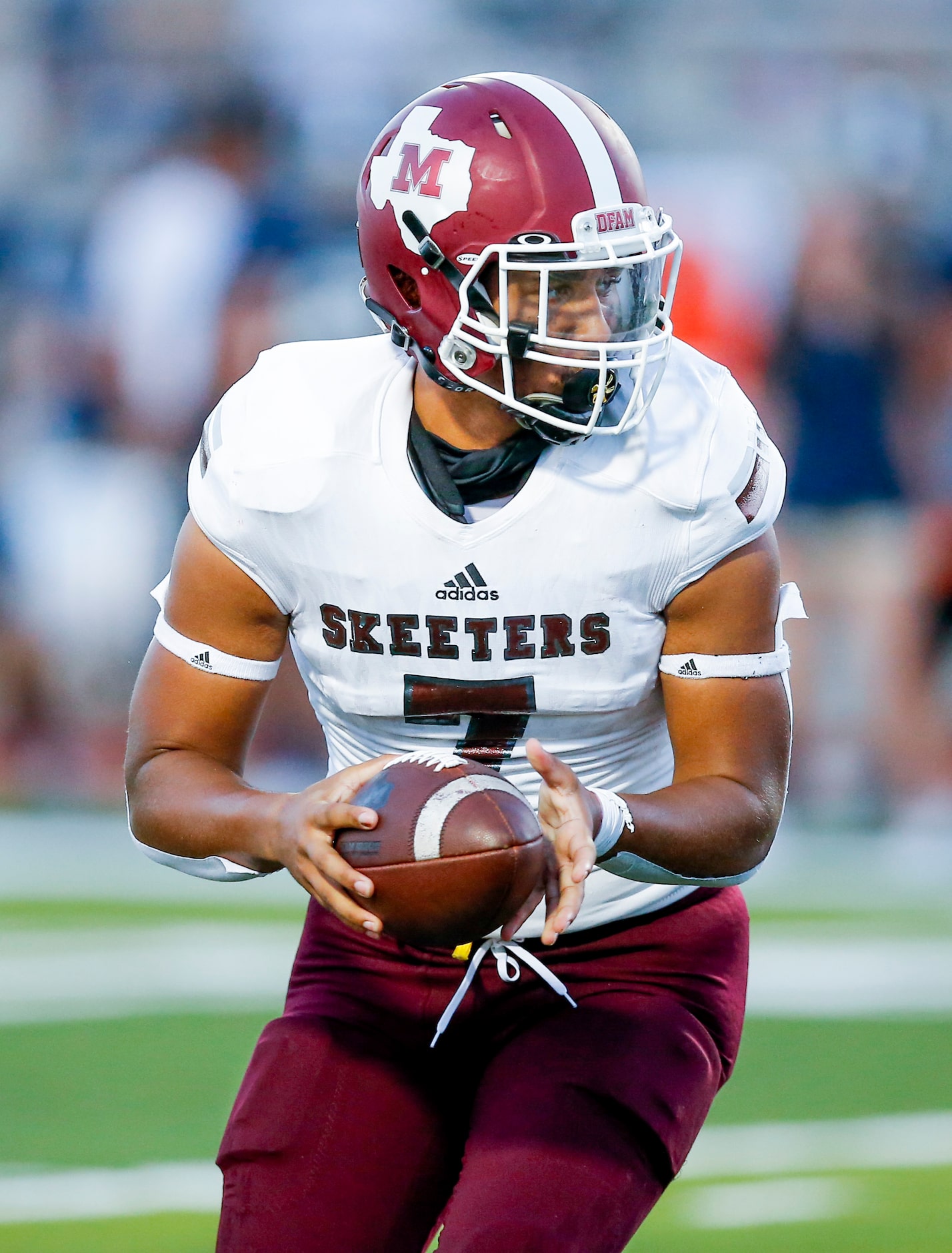 Mesquite senior quarterback Chance Edwards (7) looks to hand the ball off during the first...