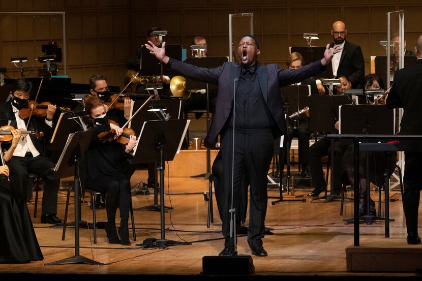 DSO Board Member Quincy Roberts performs at the 2020 C-Suite Christmas, outstretching his...