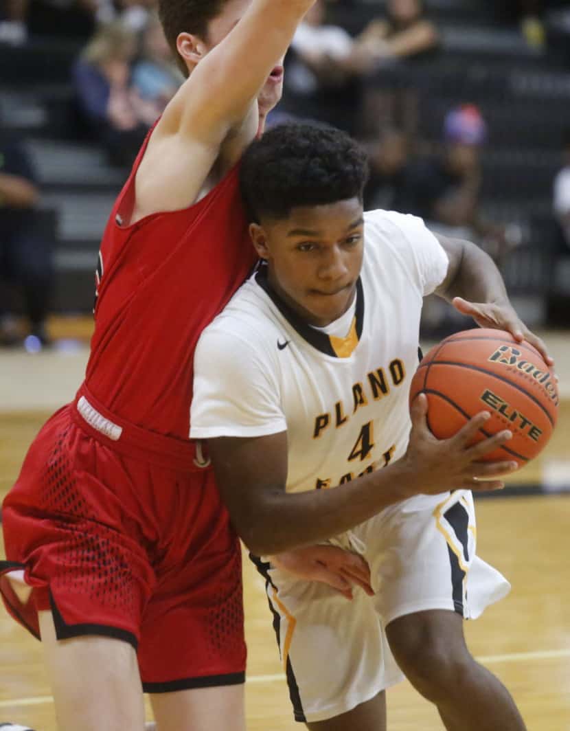 Flower Mound Marcus Carson Walls, #15, tries to stop Plano East Zadok Wilson, #4, during...