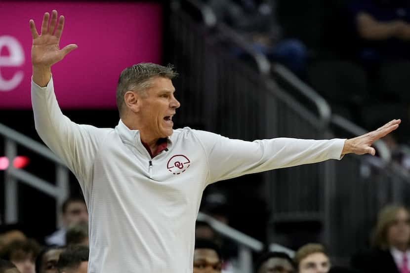 Oklahoma head coach Porter Moser motions to his players during the first half of an NCAA...