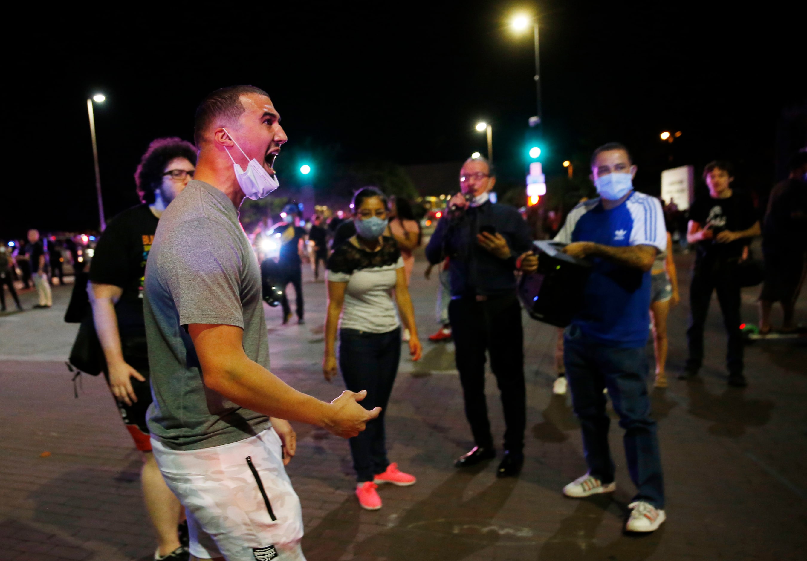 Protesters rally during a demonstration against police brutality in downtown Dallas, on...