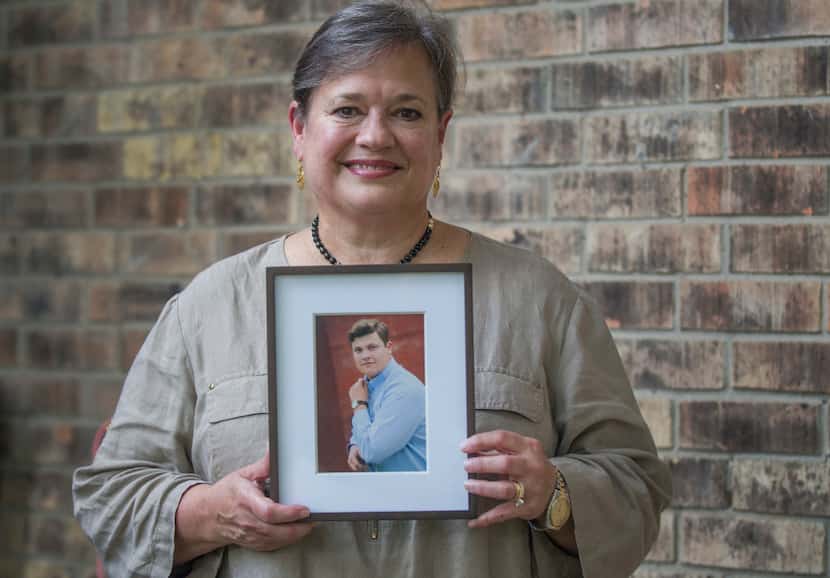 Hilda Brewer holds a portrait of her son Matthew Brewer, a freshman caught in Harvey at Rice...