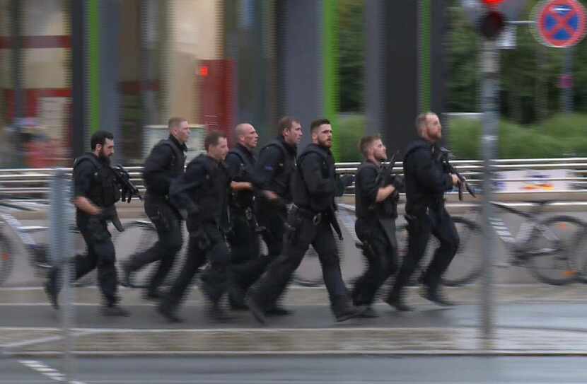 In this grab taken from video, police run in the area of the Olympia Einkaufszentrum mall,...