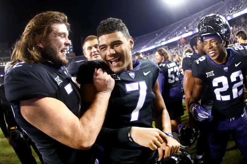 TCU quarterback Kenny Hill (7) celebrates with teammates, including offensive lineman Nick...