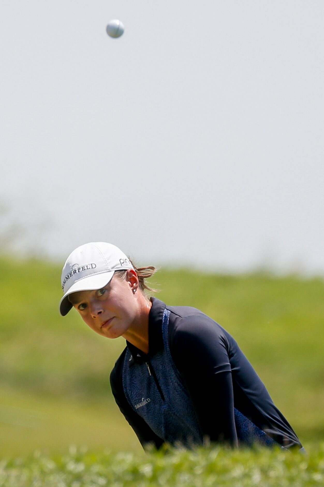 Professional golfer Esther Henseleit chips a ball onto the No. 4 green during the final...