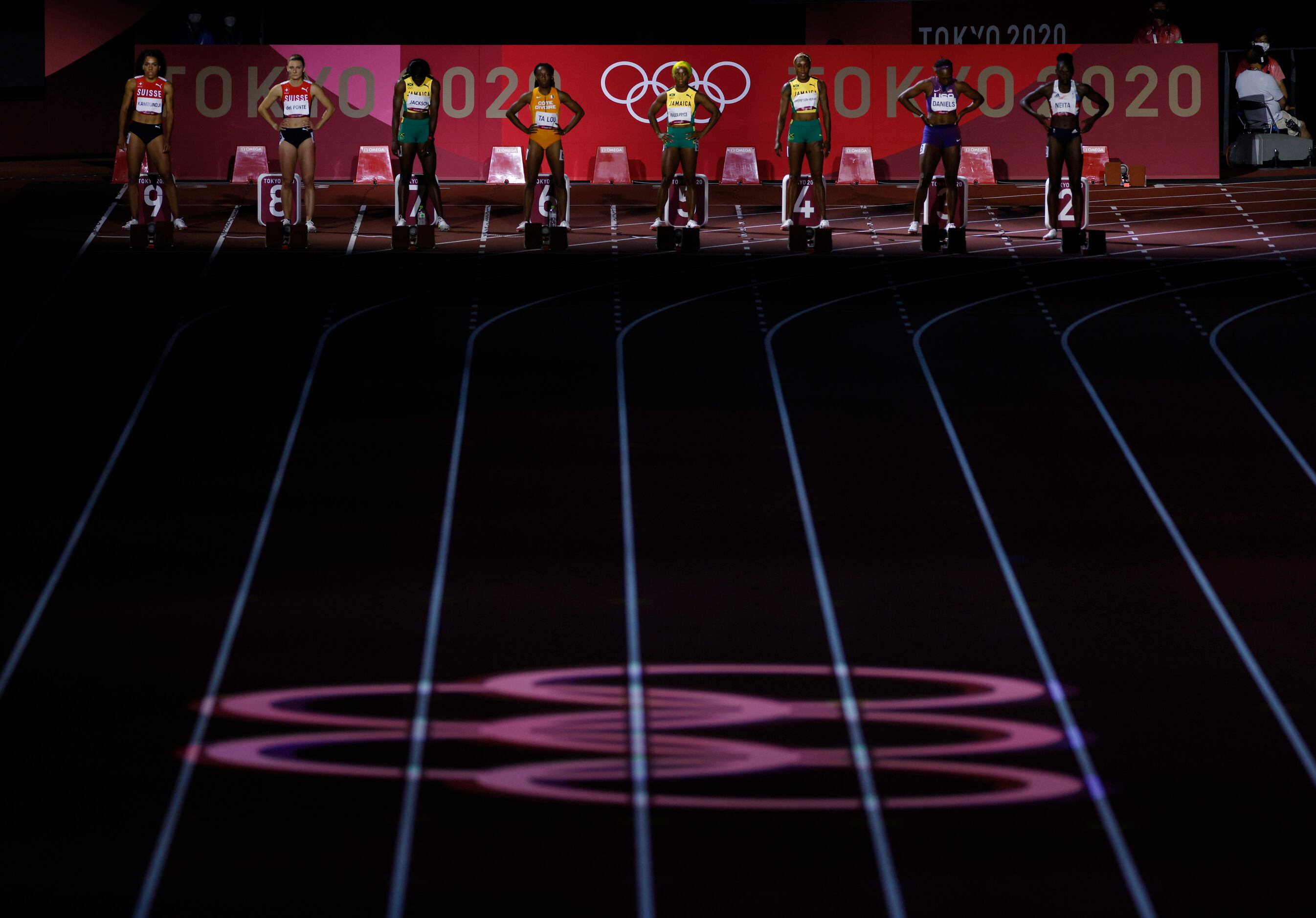 Light display during the introductions for the women’s 100 meter final race during the...