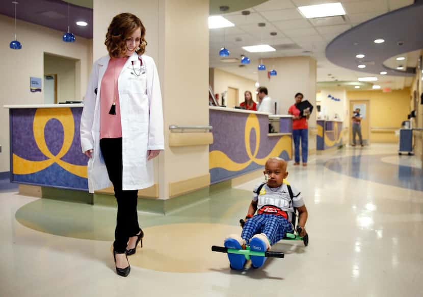 Dr. Tiffany Simms-Waldrip (left) walks the halls of the Stem Cell Transplant Unit with...