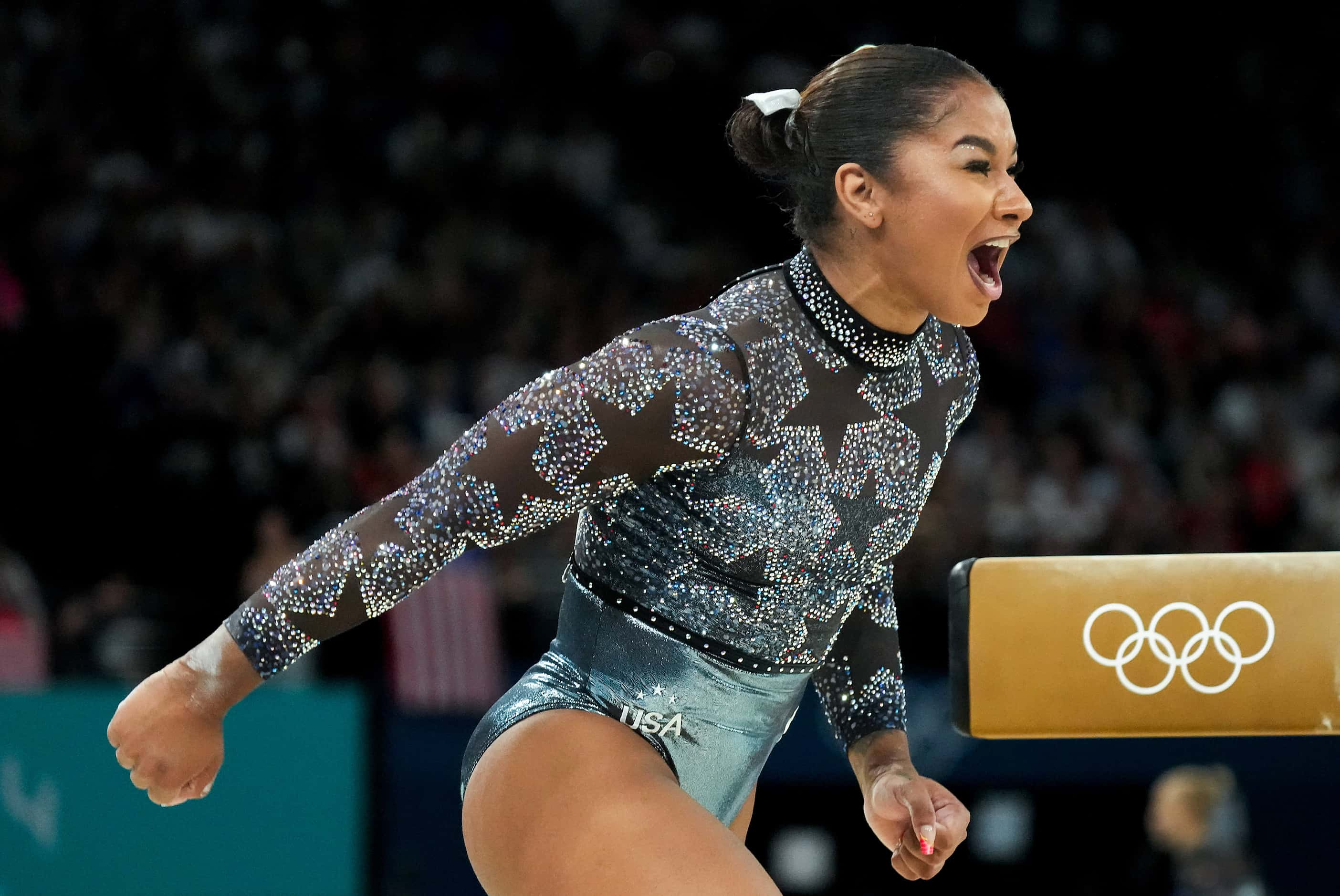 Jordan Chiles of the United States celebrates after competing on the balance beam during...