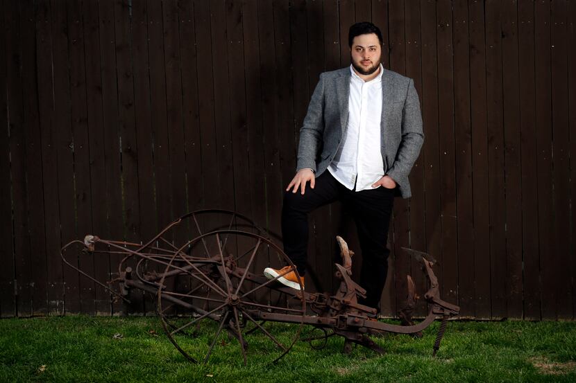 Verdigris Ensemble artistic director Sam Brukhman poses with a plow that will be installed...