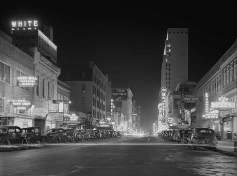 
This photo by Arthur Rothstein shows Elm Street in downtown Dallas in 1942. The Majestic is...