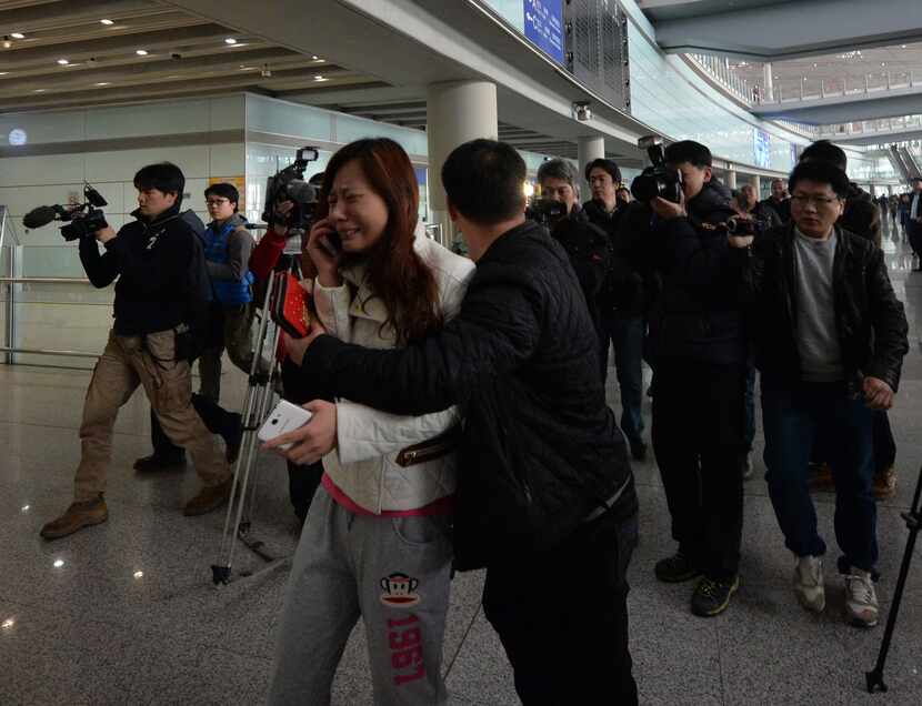 A scene at the Beijing Airport after news of the missing Malaysia Airlines Boeing 777-200 on...