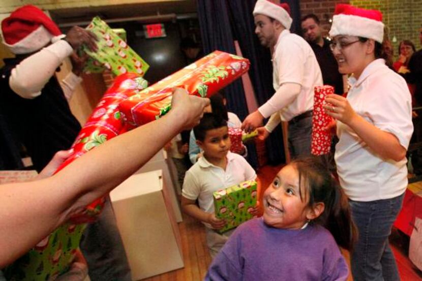 
Students at B.H. Macon Elementary School are given surprise Christmas presents from...