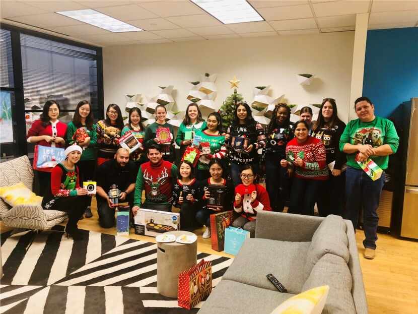 Presidium workers hammed it up at a holiday ugly sweater gift exchange.