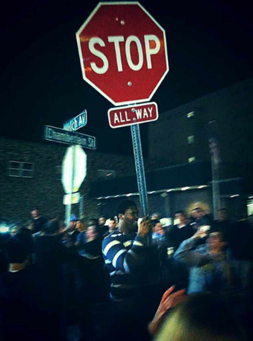 David Irving, pictured above holding a stop sign, didn't play in his senior year at Iowa...
