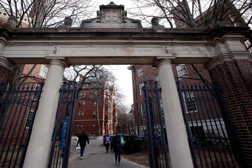  In this Dec. 13, 2018, file photo, a gate opens to the Harvard University campus in...