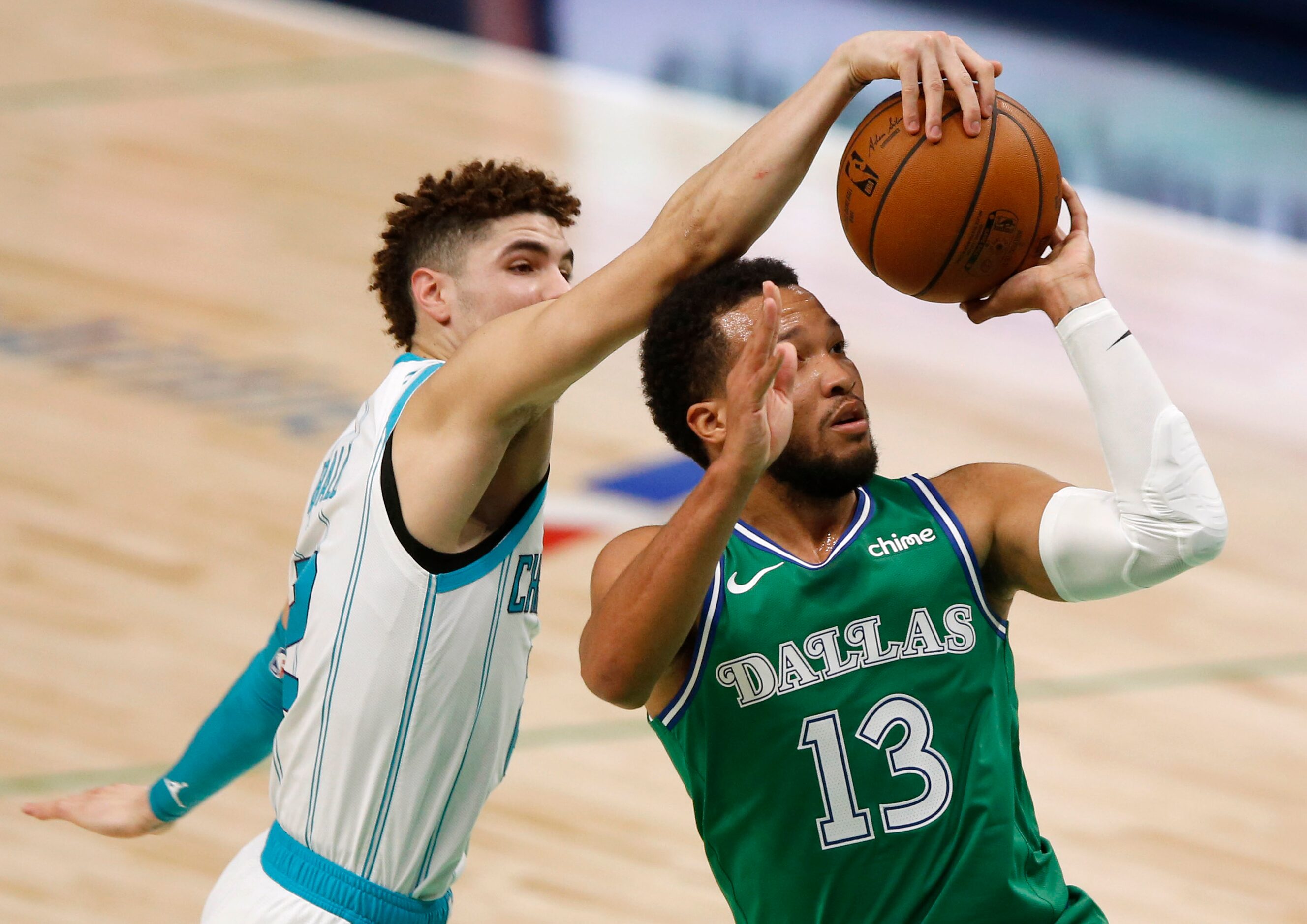 Charlotte Hornets guard LaMelo Ball (2) blocks a shot attempt from Dallas Mavericks guard...