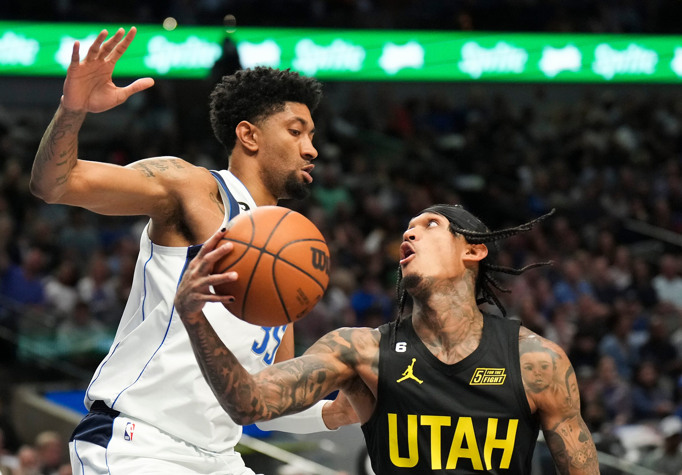 Dallas Mavericks center Christian Wood (35) defends against Utah Jazz guard Jordan Clarkson...