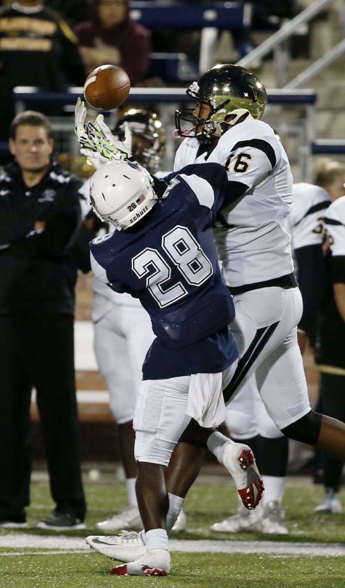 Allen's Nick Allen (28) breaks up a pass intended for Plano East's Mikail Simmons (16)...