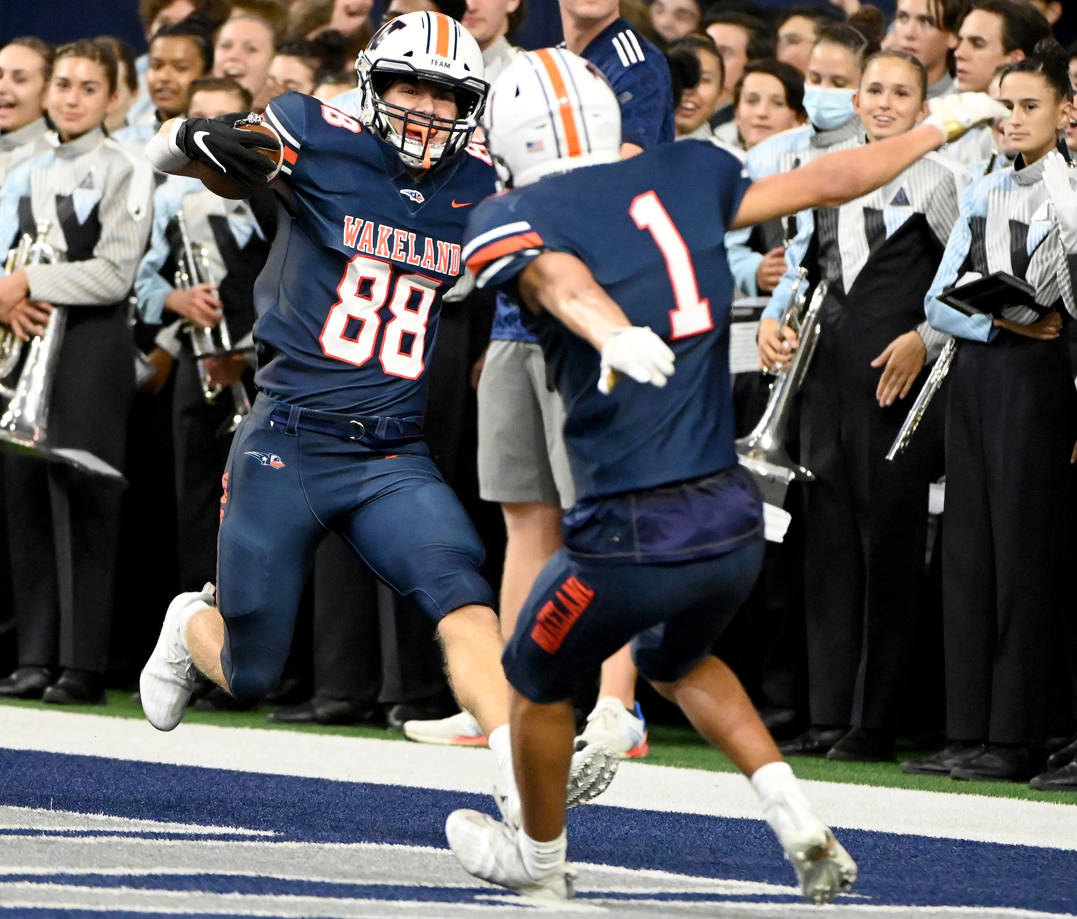 Frisco Wakeland's wide receiver Cody Johnson (88) celebrates his touchdown catch with Davion...