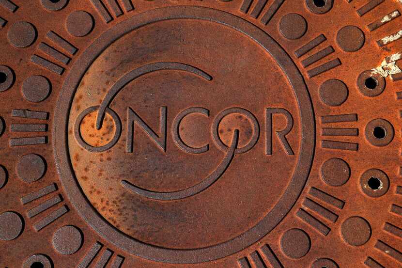 An Oncor sewer manhole cover next to Katy Trail in Dallas.