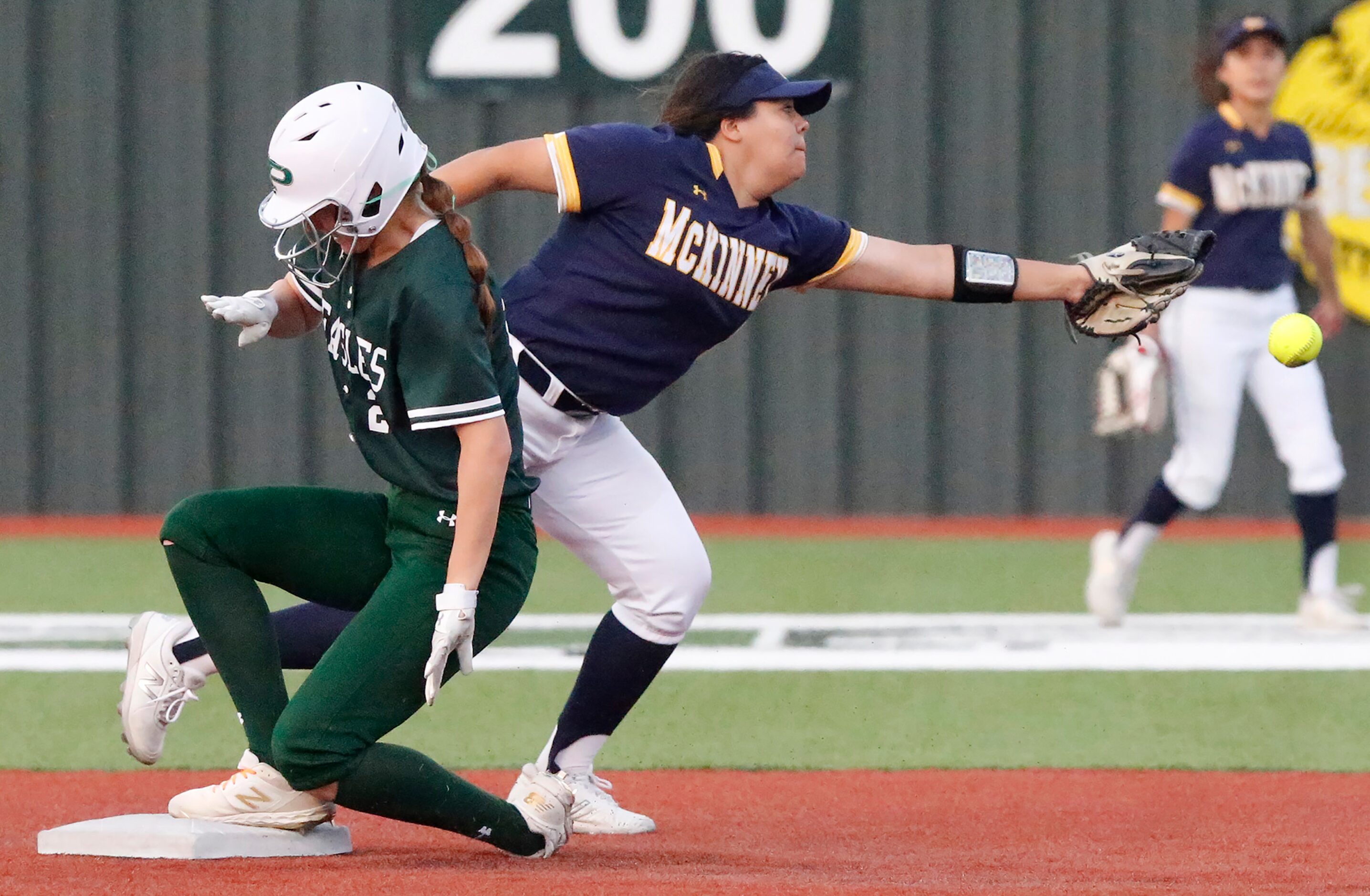 Prosper base runner Ayden Allen (23) steals second base as McKinney shortstop Giselle...