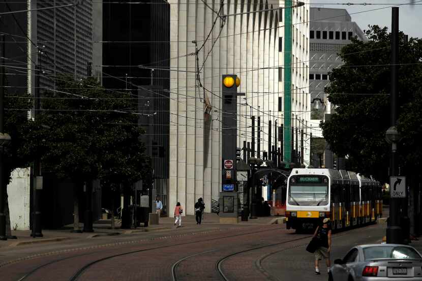 An eastbound train approaches the Akard Station near DART's headquarters in downtown Dallas...