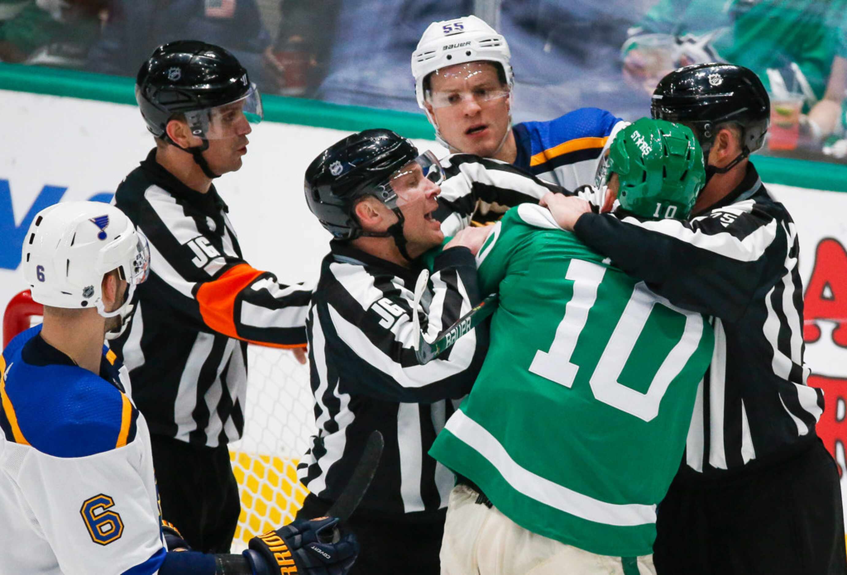 Referees break up a fight between St. Louis Blues defenseman Colton Parayko (55) and Dallas...