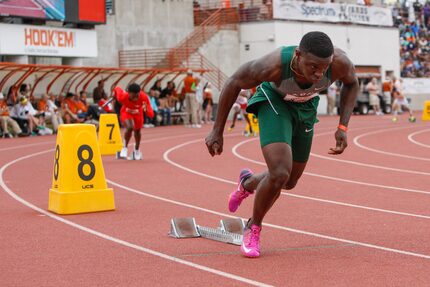 Waxahachie's Jalen Reagor, right, leaves the starting blocks during the boys 4x200 meter...